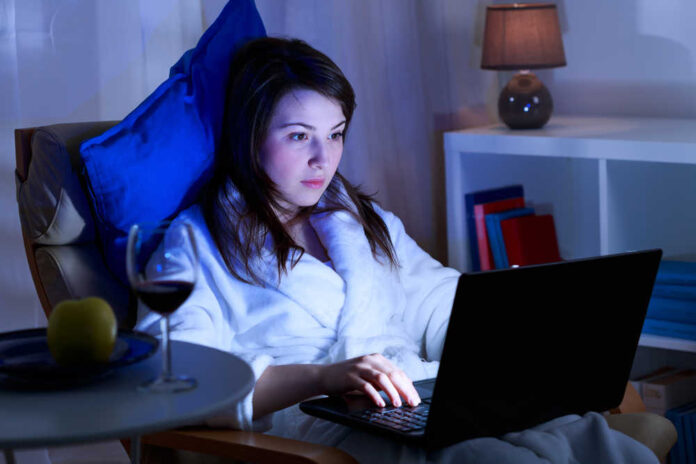 Attractive,Girl,Is,Spending,Time,In,Front,Of,Her,Laptop