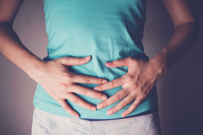 Woman,Hands,On,Her,Stomach,,Probiotics,And,Prebiotics,Food,For