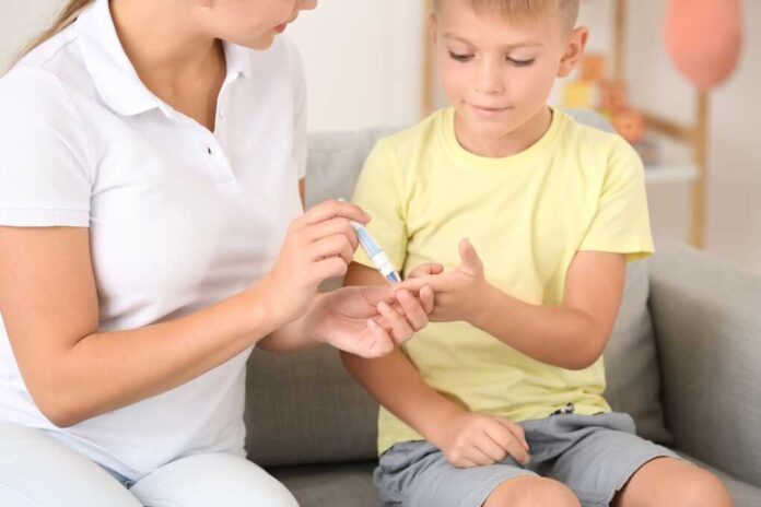 Mother,Taking,Blood,Sample,Of,Diabetic,Son,At,Home