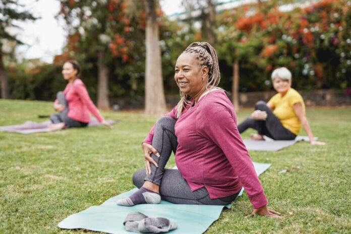Multiracial,Women,Doing,Yoga,Exercise,With,Social,Distance,For,Coronavirus