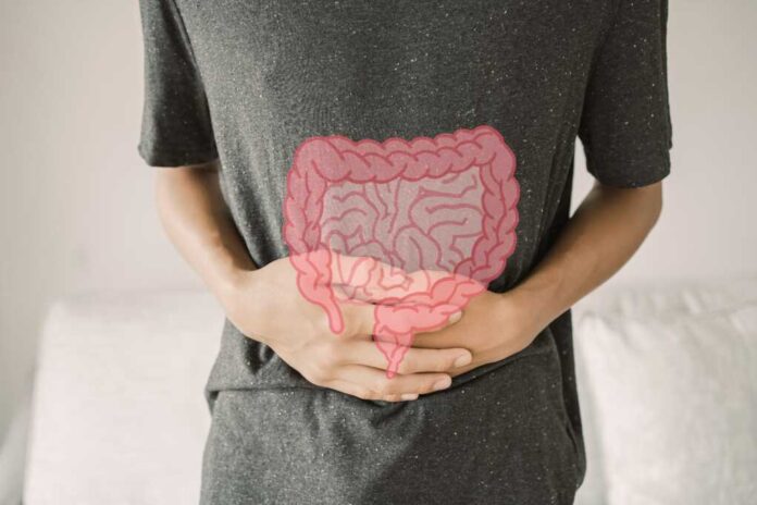 Man,Hands,On,His,Stomach,With,Intesline,,Probiotics,Food,For