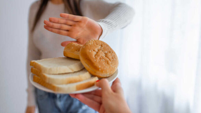 Young,Woman,On,Gluten,Free,Diet,Is,Saying,No,Thanks