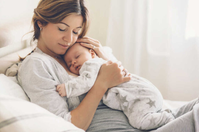 Loving,Mom,Carying,Of,Her,Newborn,Baby,At,Home.,Bright