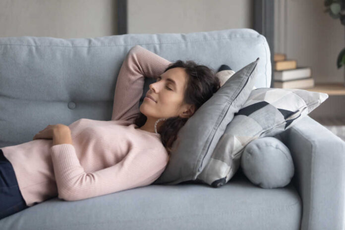 Peaceful,Young,Happy,Woman,Lying,On,Soft,Pillow,On,Comfortable