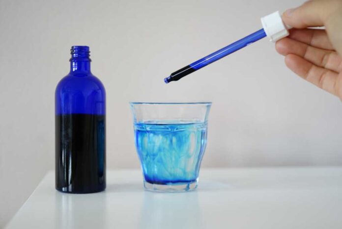 Image,Showing,A,Bottle,Filled,With,Methylene,Blue,Near,A