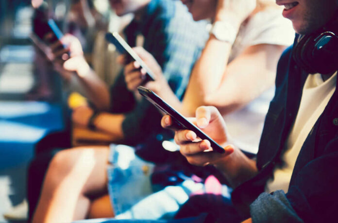 Diverse,Friends,Using,Their,Phones
