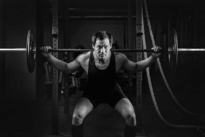 Asian,Athletic,Strong,Man,Having,Workout,And,Bodybuilding,With,Barbells