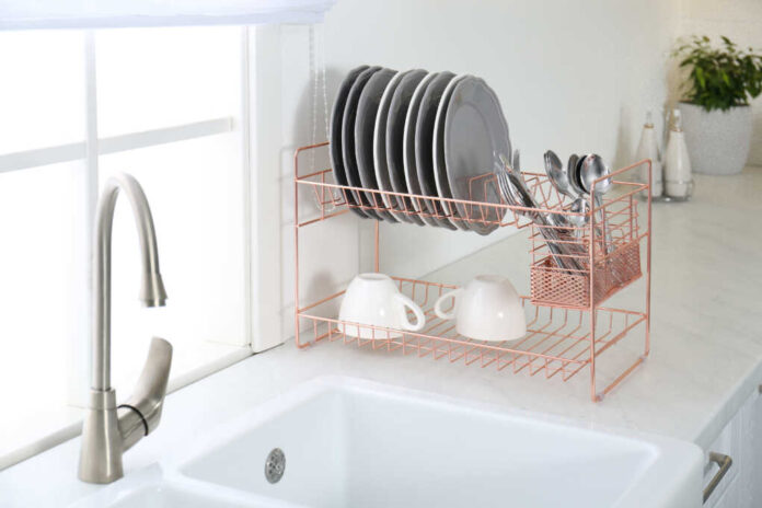 Clean,Dishes,On,Drying,Rack,In,Modern,Kitchen,Interior