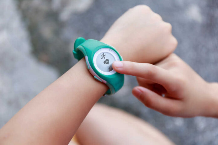 Close,Up,Girl,Using,Smartwatch,Touching,Button,And,Touchscreen,On