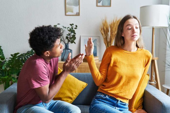 Black-skinned,Man,Begging,For,Forgiveness,And,Caucasian,Woman,Turning,Him