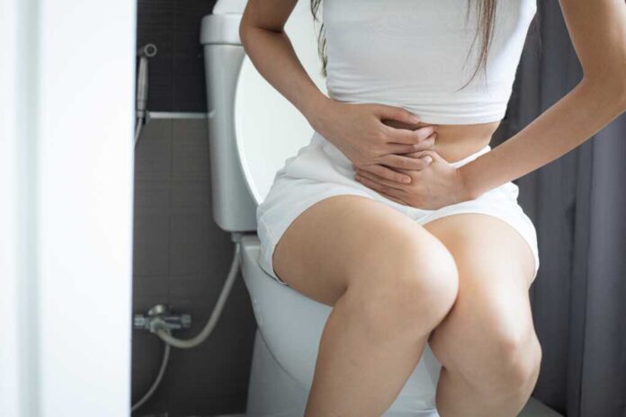 Woman,Sitting,On,The,Toilet,Having,Pain,In,Her,Stomach.