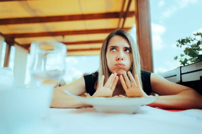 Woman,Refusing,To,Eat,Her,Meal,Feeling,Full.,Customer,Sending