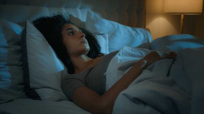 Noisy,Neighbours,Problem,Annoyed,African,American,Woman,Lying,In,Bed