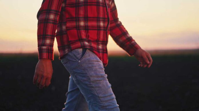 Agriculture.,Close-up,Farmer,Hand,Walking,After,Work,In,Agricultural,Field.