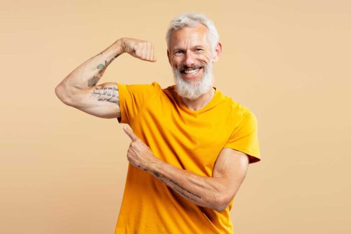 Portrait,Of,Middle,Aged,Gray,Haired,Man,Wearing,Casual,Yellow
