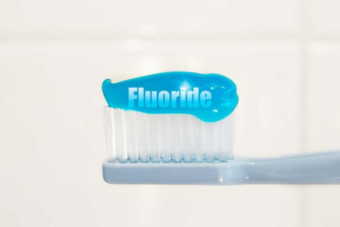 Toothbrush,And,Fluoridated,Toothpaste,On,White,Background