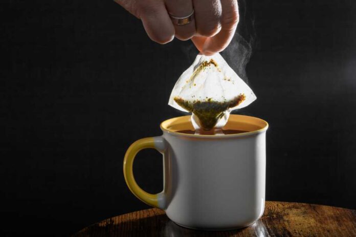 Remove,The,Tea,Bag,From,The,Hot,,Steaming,Mug