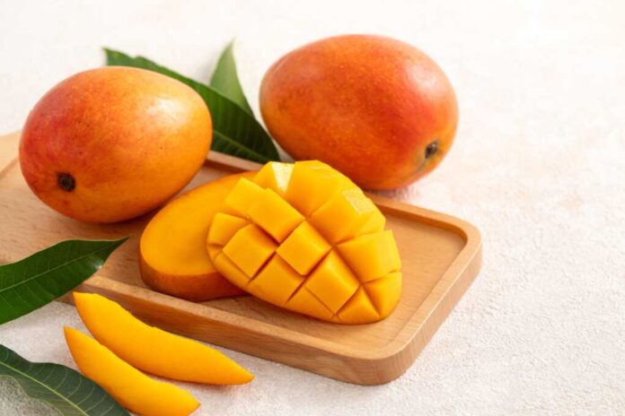 Fresh,Sliced,,Cut,,Diced,Ripe,Mango,On,Gray,Table,Background