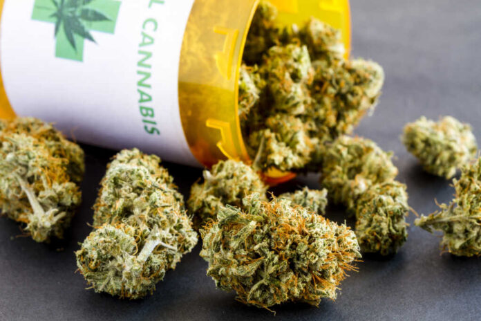 Close,Up,Of,Medical,Marijuana,Buds,Spilling,Out,Of,Prescription
